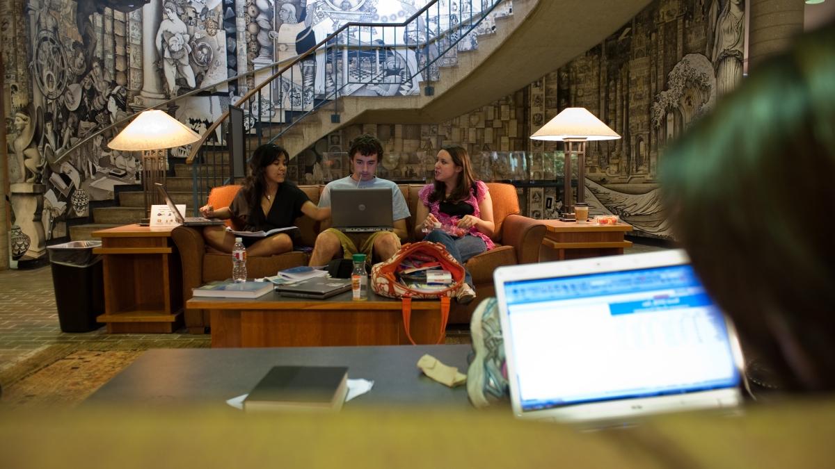 Students study together on a couch in Coates Library